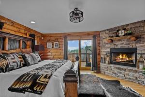 a bedroom with a bed and a fireplace at Ponderosa 1887 in Vilas