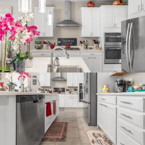 a white kitchen with stainless steel appliances and pink flowers at Goodyear Retreat Pool Slide Firepit BBQ in Perryville +4 photos