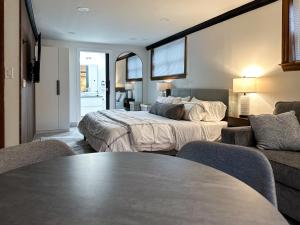 Ένα ή περισσότερα κρεβάτια σε δωμάτιο στο DTW Suites