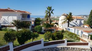 a view of a house from the top of a hill at Casa Romero in Caleta De Velez