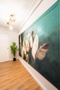 a large painting on a wall in a room at La Palomilla in Avila