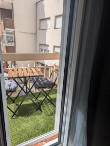 a view of a table and chairs from a window at La Palomilla in Avila