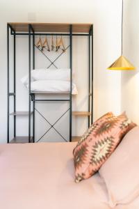 a bed with a pillow on top of it at La Palomilla in Avila