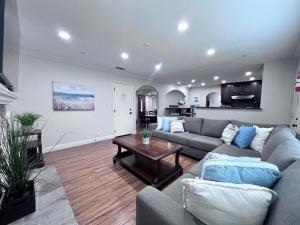 a living room with a couch and a table at Destination #15 in Anaheim