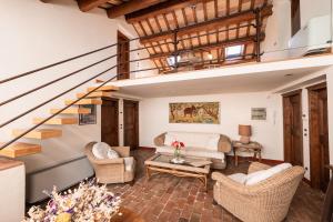 a living room with a couch and chairs at Villa Adele - Historic Dimora with pool & sea view in Senigallia