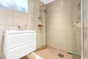 a bathroom with a shower and a sink at Luxury & Central Arendal Home in Arendal +34 photos