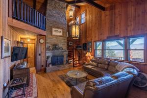 a living room with a couch and a fireplace at On Any Sunday in Blowing Rock
