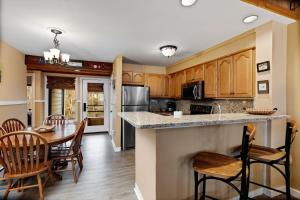 a kitchen and dining room with a table and chairs at Dobie 21 With Wintergreen Advantage in Mount Torry Furnace