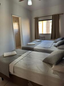 Ένα ή περισσότερα κρεβάτια σε δωμάτιο στο Hotel Mão de Fatima