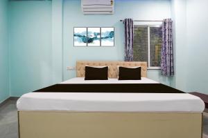 Ένα ή περισσότερα κρεβάτια σε δωμάτιο στο Hotel O JANNAT