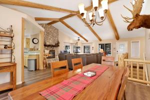 a dining room and living room with a wooden table at Castle Glen Gem #2220 in Big Bear Lake
