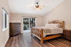 a bedroom with a bed and a ceiling fan at Castle Glen Gem #2220 in Big Bear Lake