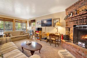 a living room with a couch and a fireplace at Idle hours inn #1945 in Big Bear City