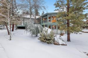 a house with a snow covered yard in front of it at Castle Glen Gem #2220 in Big Bear Lake