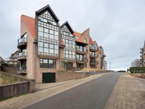an empty street in front of a building at Delfien A in Galopen