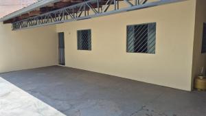 an empty garage with two windows and a roof at Excelente casa na Nova Maraba in Marabá