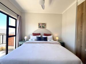 Ένα ή περισσότερα κρεβάτια σε δωμάτιο στο Sunset & Soul