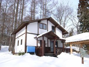 a tiny house in the woods in the snow at Cottage All Resort Service / Vacation STAY 8419 in Inawashiro