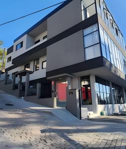 a large white building with a lot of windows at Loft 06 Vila Germânica Oktoberfest Blumenau in Blumenau