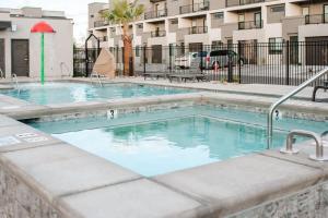 a swimming pool at a apartment complex at 20| Vue at Green Valley with Community Pool in St. George +67 photos