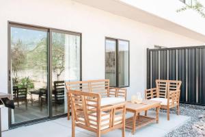 a dining room with a table and chairs on a patio at 19-20| 2 Homes in St. George Green Valley with Community Pool in St. George