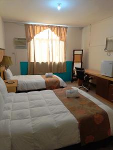 Кровать или кровати в номере Hotel Manta Real