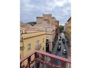 a view of a city street from a balcony at Hostal la Barretina in Figueres