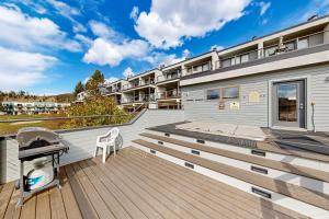 a deck with a grill on top of a house at East Bay 6 in Dillon