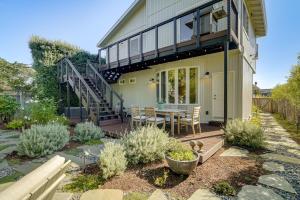 a house with a deck with a table and chairs at Walk to Ocean Luxe Family Home in Half Moon Bay! in Half Moon Bay