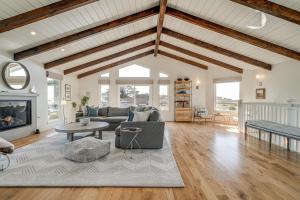 a living room with a couch and a fireplace at Walk to Ocean Luxe Family Home in Half Moon Bay! in Half Moon Bay