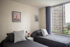 Ένα ή περισσότερα κρεβάτια σε δωμάτιο στο Apartartment 2 Bedrooms Suite Macul Metro Fully Equipped +95 φωτογραφίες