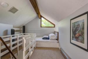 a small room with a bed and a window at Top Of Seven in Seven Devils