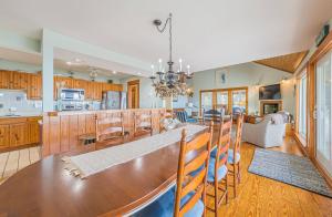 a kitchen and dining room with a table and chairs at Family Tradition - Duck, Sanderling, Soundfront, Private Pier, Sunset Views, Community Pool, Pets OK in Duck +32 photos