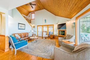 a living room with a wooden ceiling at Family Tradition - Duck, Sanderling, Soundfront, Private Pier, Sunset Views, Community Pool, Pets OK in Duck