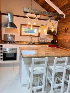 Kuchyň nebo kuchyňský kout v ubytování Cabañas Laguna Magica