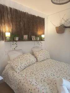 a bedroom with a bed with two pillows at villa Léonfine in Le Cannet-des-Maures