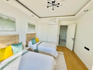 En eller flere senge i et værelse på Wanderlust Executive Stay