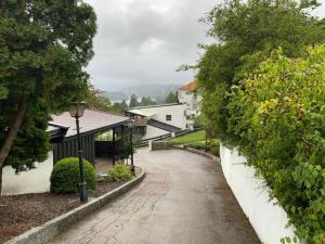 a cobblestone street in a village with a street light at Apartment for rent in Oslo
