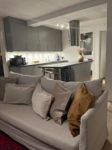 a couch with pillows on it in a kitchen at Apartment for rent in Oslo