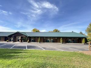 a building with a parking lot in front of it at Windjammer Lodge in Ogdensburg