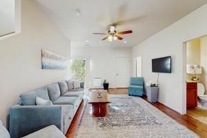 a living room with a couch and a ceiling fan at Pikes Peak West in Flagstaff