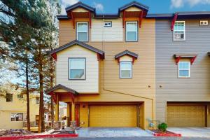 a yellow house with a garage at Pikes Peak West in Flagstaff