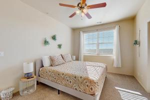 a bedroom with a bed and a ceiling fan at Pikes Peak West in Flagstaff