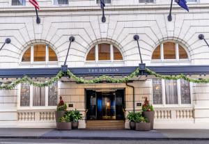 a building with plants in front of it at The Benson Portland, Curio Collection by Hilton in Portland