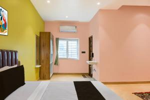 Ένα ή περισσότερα κρεβάτια σε δωμάτιο στο Hotel O PALLAVI INN