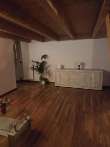 an empty room with a desk and a wooden floor at La Dimora di Vittorio Emanuele II in Barletta +54 photos