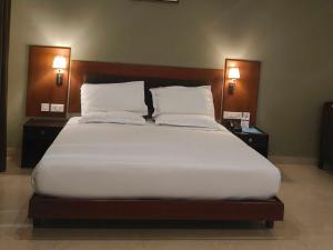 Ένα ή περισσότερα κρεβάτια σε δωμάτιο στο Hotel O Thumba Beach Trivandrum