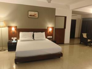 Ένα ή περισσότερα κρεβάτια σε δωμάτιο στο Hotel O Thumba Beach Trivandrum +8 φωτογραφίες