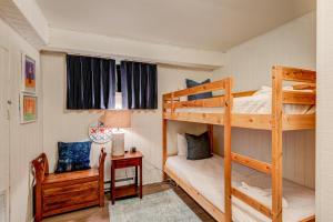 a bedroom with a bunk bed and a desk at Orchid Cabin in Banner Elk