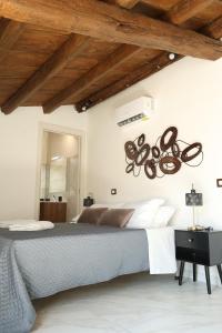 Ένα ή περισσότερα κρεβάτια σε δωμάτιο στο Sikelìa Apartment